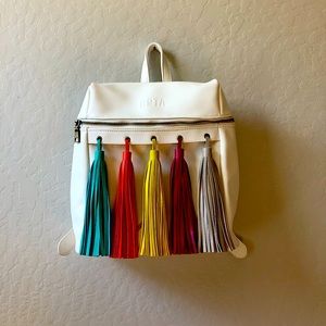 BOTA white backpack with colorful tassles